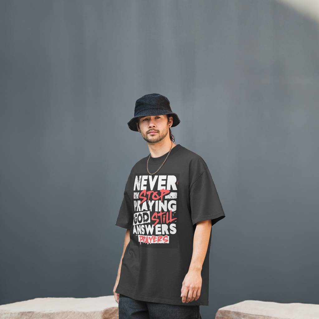 Never Stop Praying Oversized faded t-shirt